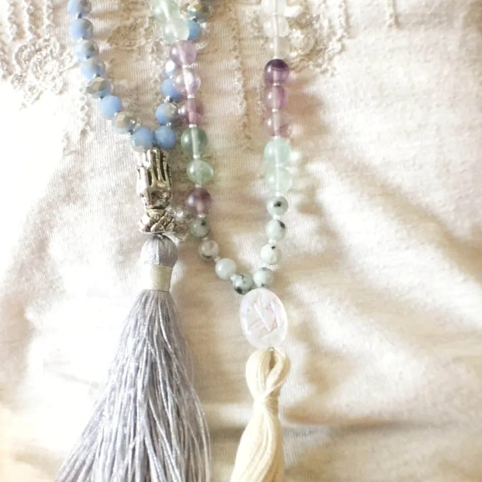A string of beads with a tassel.