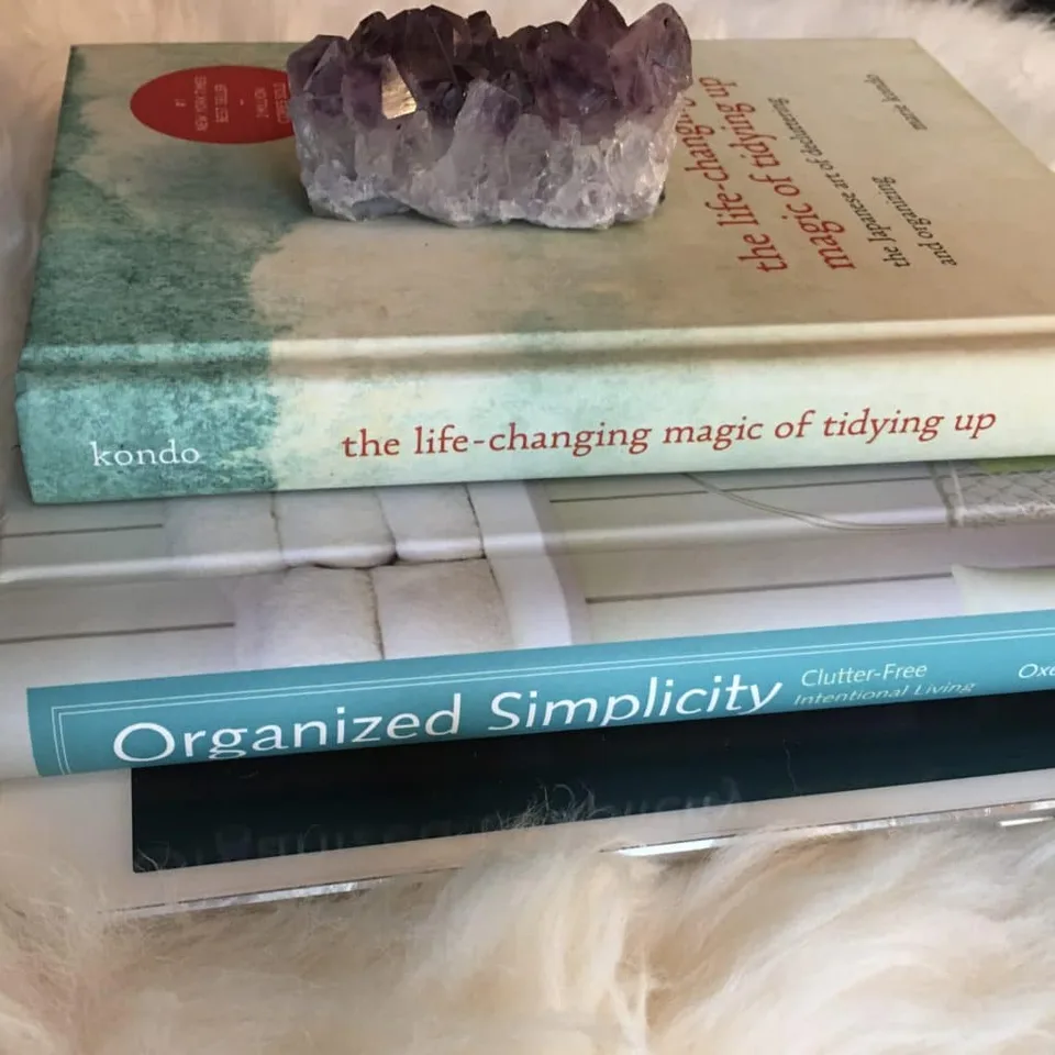 A stack of books about tidying and simple living.
